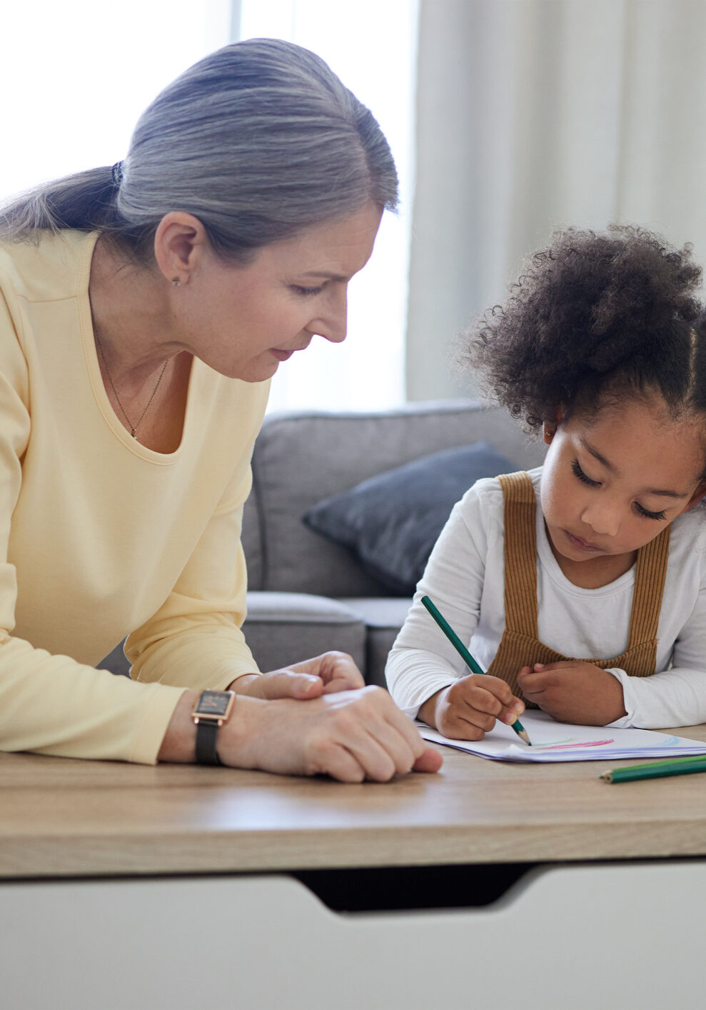 Expert school psychologist working with a young student during a counseling session